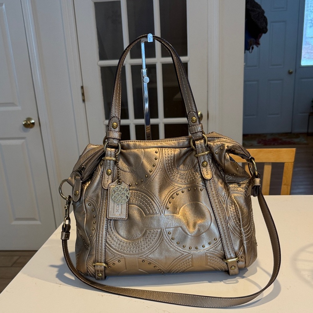 Coach Alexandra studded leather tote bag in champagne gold.
